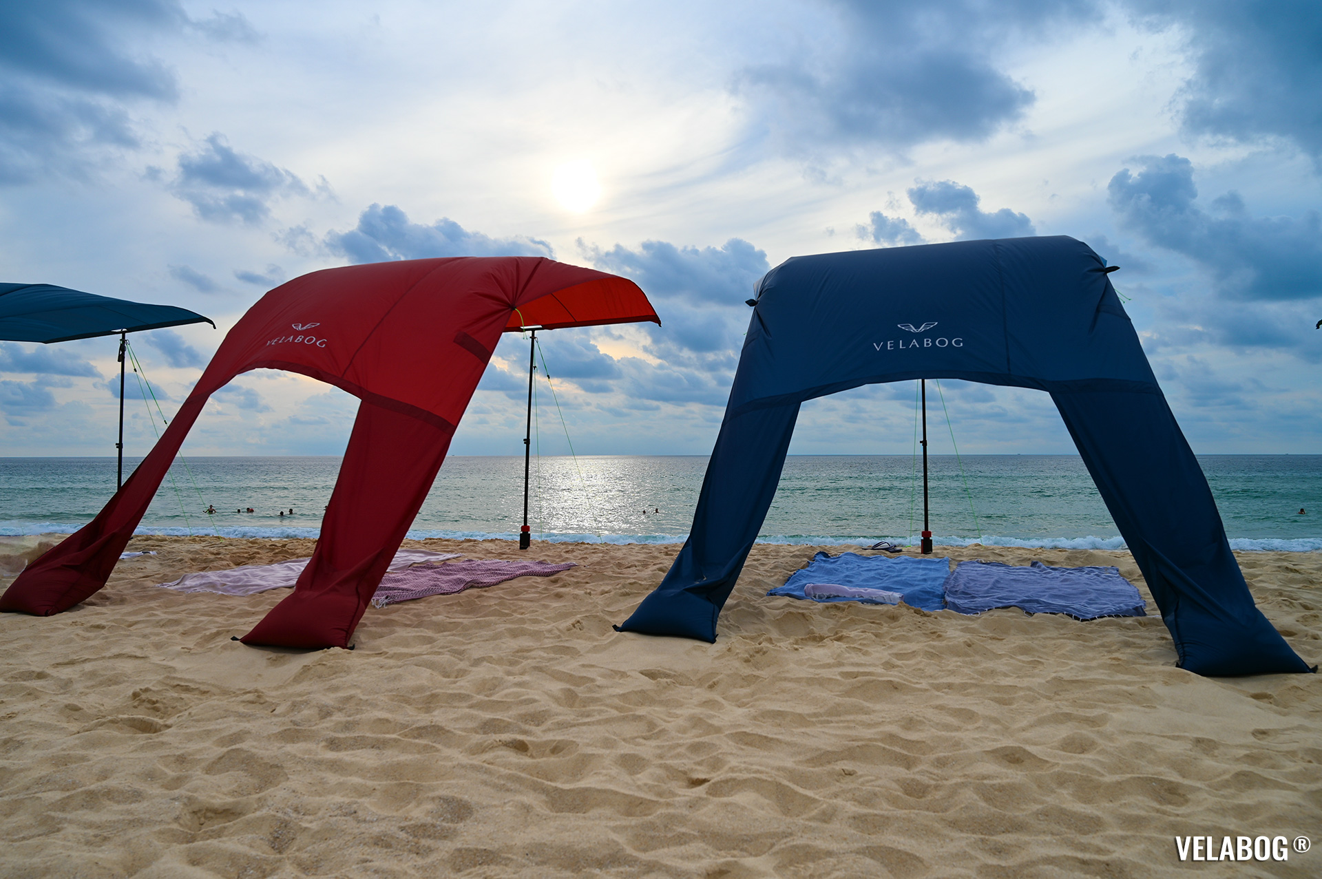Two beach sun sails Velabog Breeze. Best beach canopy, tent, sun shelter on windy beach. Setup option for light to strong wind. View from behind.